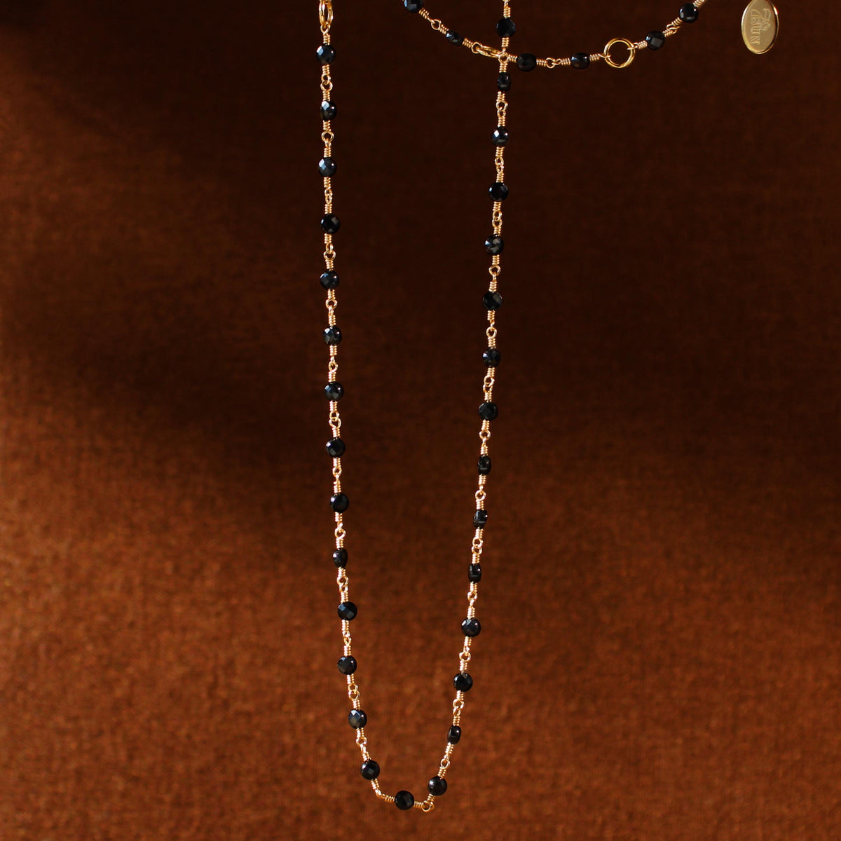 Sacred Strand Black Spinel Coin